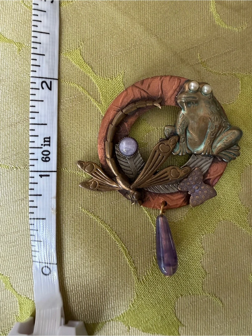 Brooch with whimsical frog and dragonfly on wreath in mixed metals. See photos